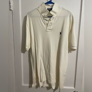 Polo size large no damages. Color is crème.